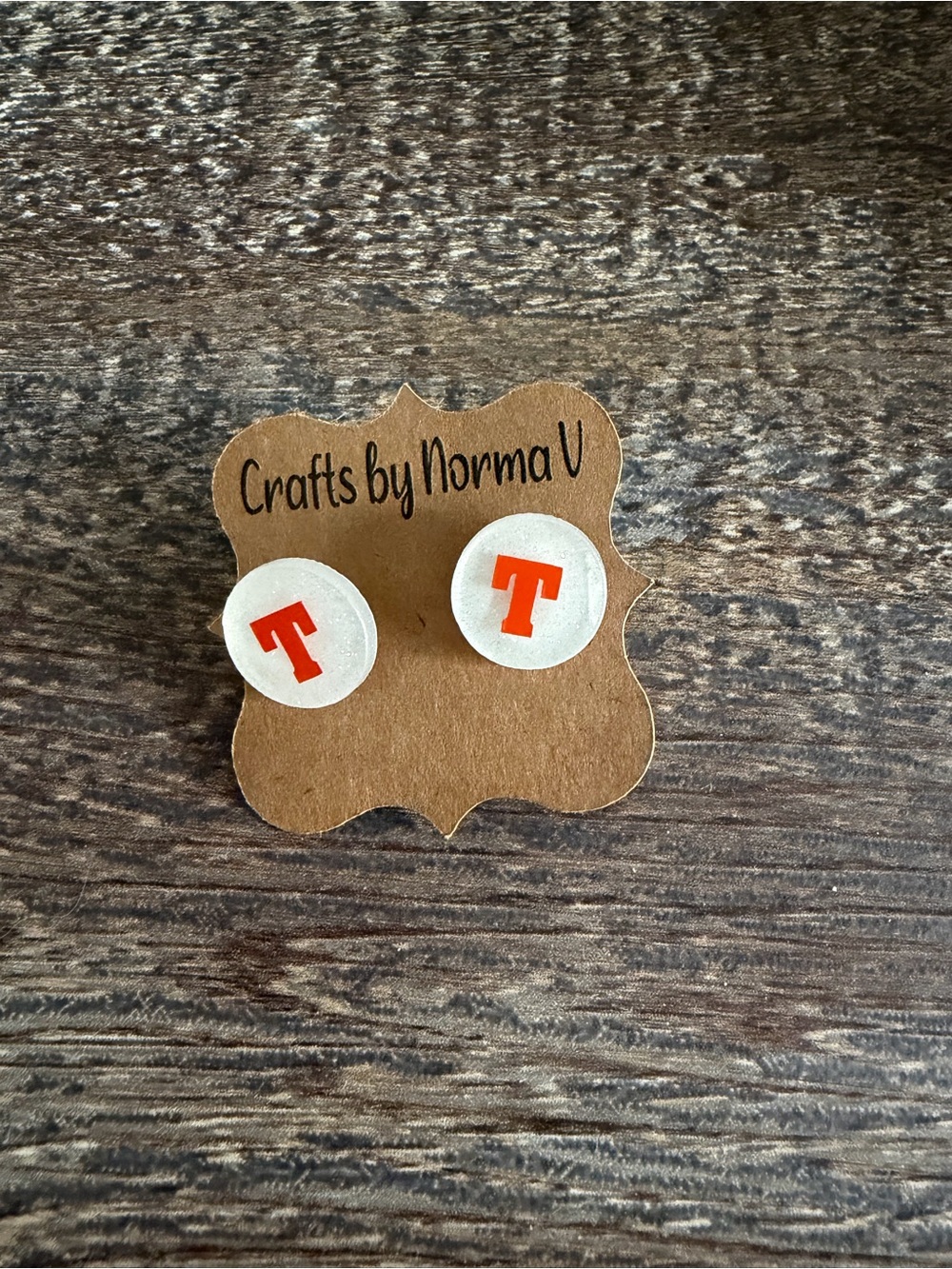 White Resin Stud Earrings with Orange 'T'